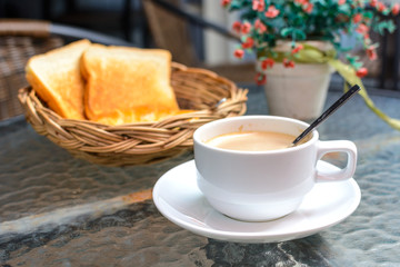 Cup of coffee with bread