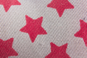 Grey textile with printed red stars