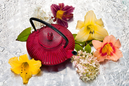 tea ceremony: tea pot with flowers on a rainy day