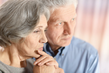 sad elder couple
