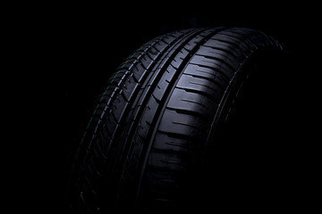 Car tire isolated on black background