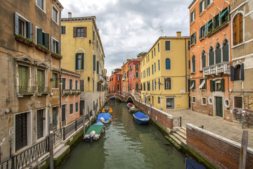 venetian channel with gondolas in Venetia Italy