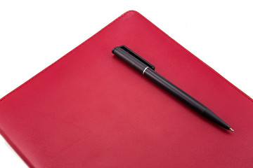 Leather notebook and pen isolated on the white background
