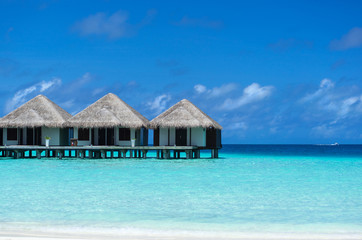 Beautiful beach with water bungalows at Maldives