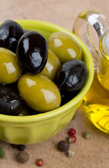 green and black olives in a green oil
