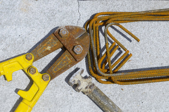 costruction equipment: scissor hammer shaped iron brackets
