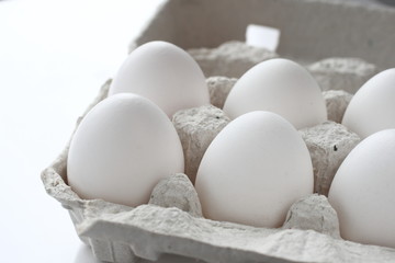 White chicken raw eggs in a box