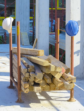 Construction site: container beams with helmets