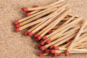 red matches on a wood background.