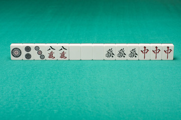 Smooth table surface with a mahjong on it