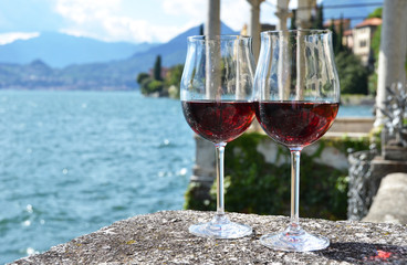 Two wineglasses. Varenna town at the lake Como, Italy
