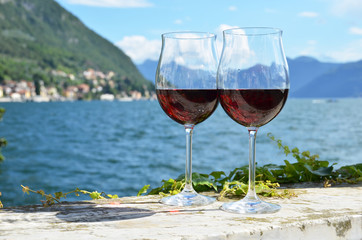 Two wineglasses. Varenna town at the lake Como, Italy