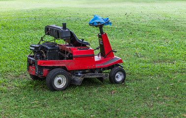 Obraz premium Lawn mower on grass in the park