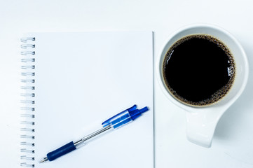 Blue Pen on Blank Note with Coffee