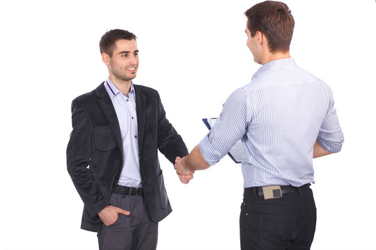 Two business men shaking hands and one of them holding a folder