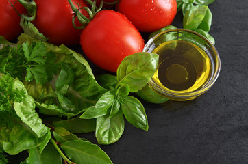 tomatoes, fresh basil leaves and olive oil. healthy food