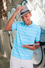 Young attractive male using tablet pc.