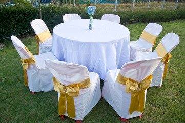 Wedding Chairs and covers at an outdoor wedding