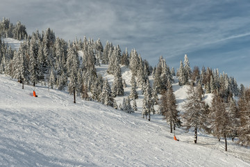 Fototapeta na wymiar Ski slope on resort in Austrian Alps