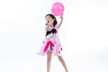 Fototapeta na wymiar Happy asian girl playing ball on white background
