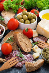 assortment of delicious antipasti, vertical