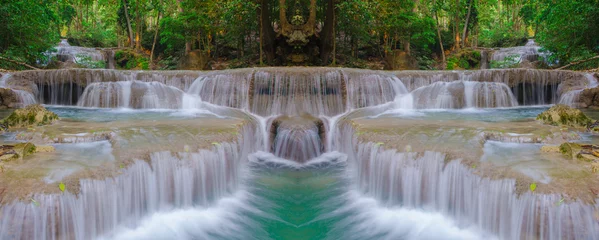 Zelfklevend Fotobehang Waterfall in Deep forest at Erawan waterfall National Park © CasanoWa Stutio