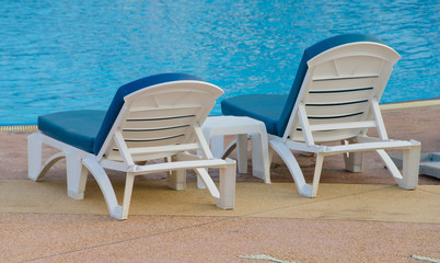 Beach chairs near swimming pool