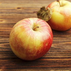 Red apples on wooden table