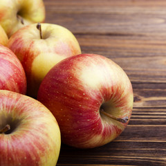red apples on wooden table