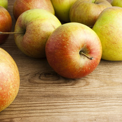 red apples on wooden table