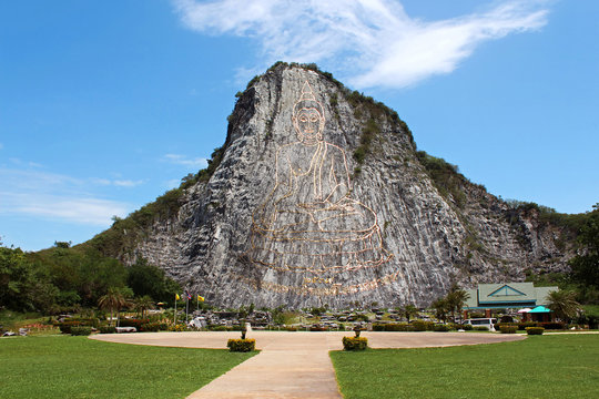 Carved buddha image on the cliff at Khao Chee Jan, Pattaya