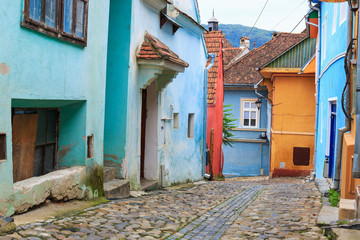 Naklejka premium Medieval street view in Sighisoara founded by saxon colonists in