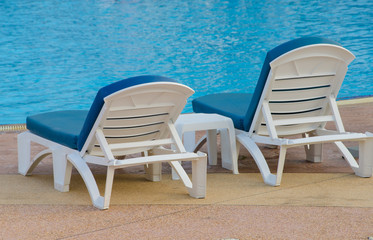 Beach chairs near swimming pool