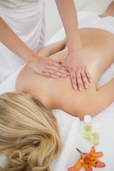 Obraz na płótnie Canvas Blonde enjoying a back massage
