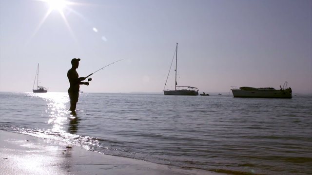 Fisherman silhouette at Ria Formosa, Algarve.