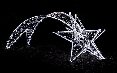 Shiny christmas street decoration in the shape of a comet made o