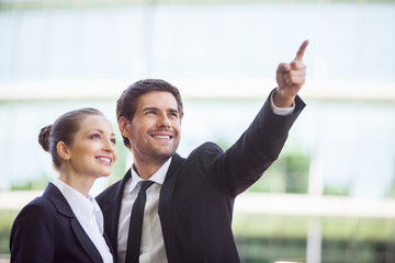Portrait of business people standing outside.