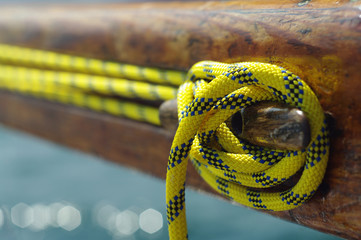 Closeup of old vintage boat snatch cleat with yellow line