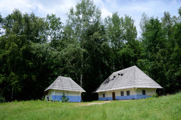 Fototapeta na wymiar Traditional old rural Ukrainian wattle and daub houses in Pirogo