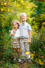 Fototapeta premium Boy with his sister in the park
