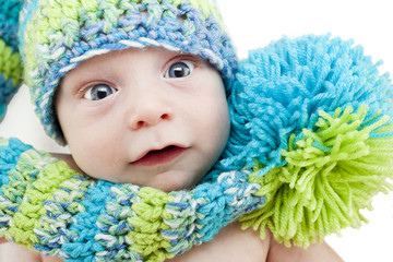 Baby portrait in woolen cap - obrazy, fototapety, plakaty