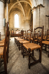 Fototapeta na wymiar Chairs In side of Notre-Dame Cathedral - Lausanne, Switzerland