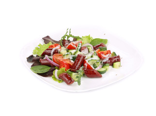 Salad with grilled sausages and arugula.
