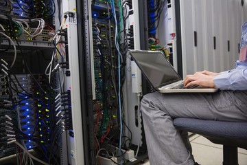 Technician sitting on swivel chair