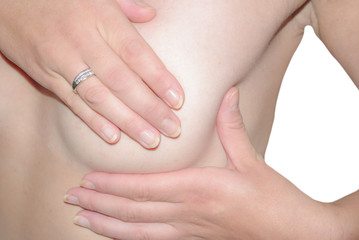 Fototapeta na wymiar Woman examining her breast