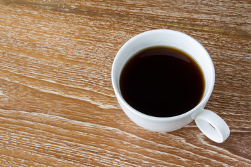 Cup of coffee on wooden table