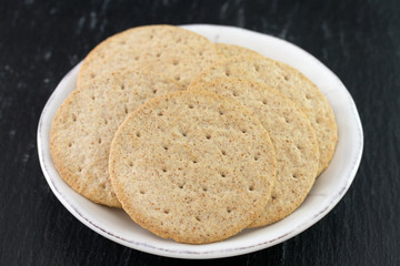 cookies on plate on dark background