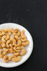 salted cashew on white plate