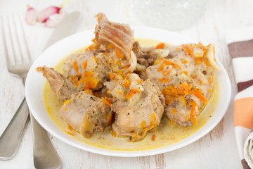 boiled rabbit with carrot on plate