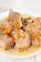 rabbit with carrot on white plate